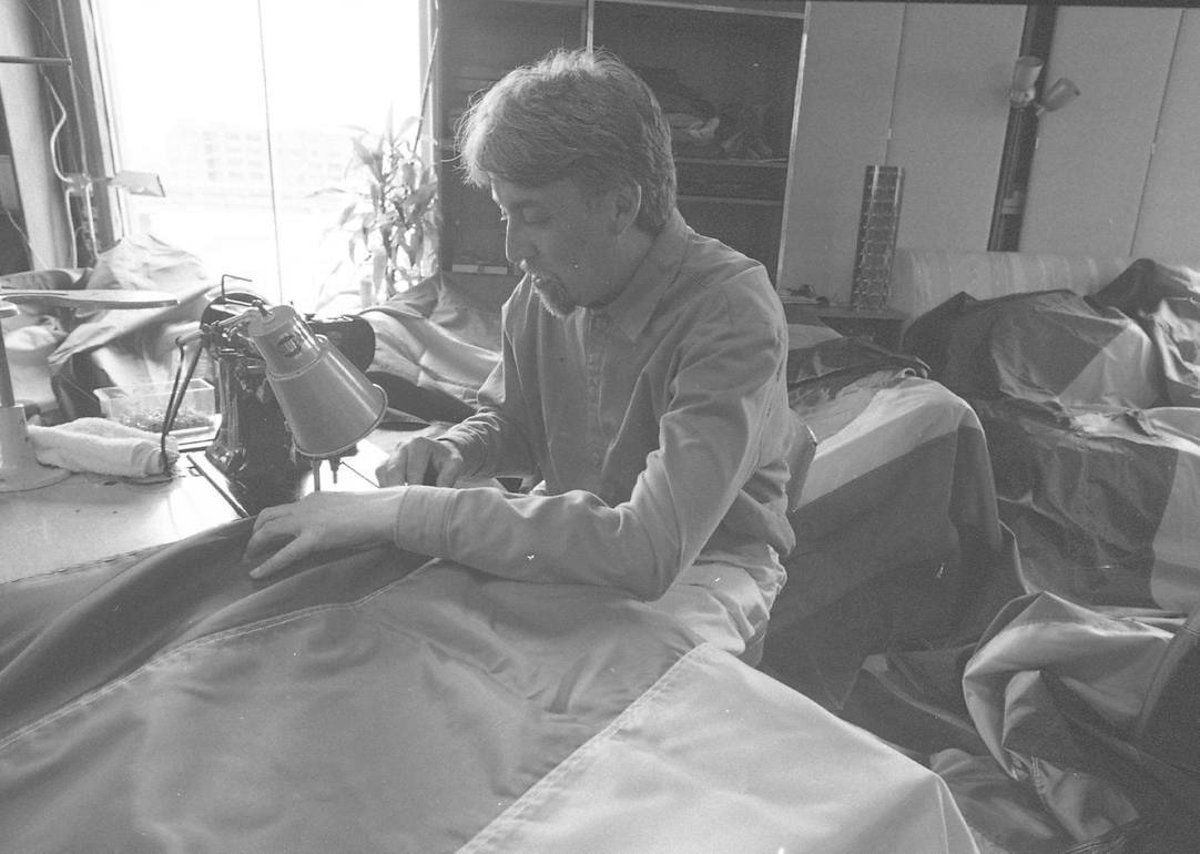 Gilbert Baker, the artist who designed the Rainbow Flag, making 500 new flags for an installation on Market St. in 1998.