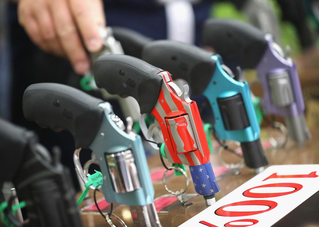 Gun enthusiasts look over Charter Arms pistols at the NRA Annual Meetings & Exhibits on May 21, 2016 in Louisville, Kentucky.