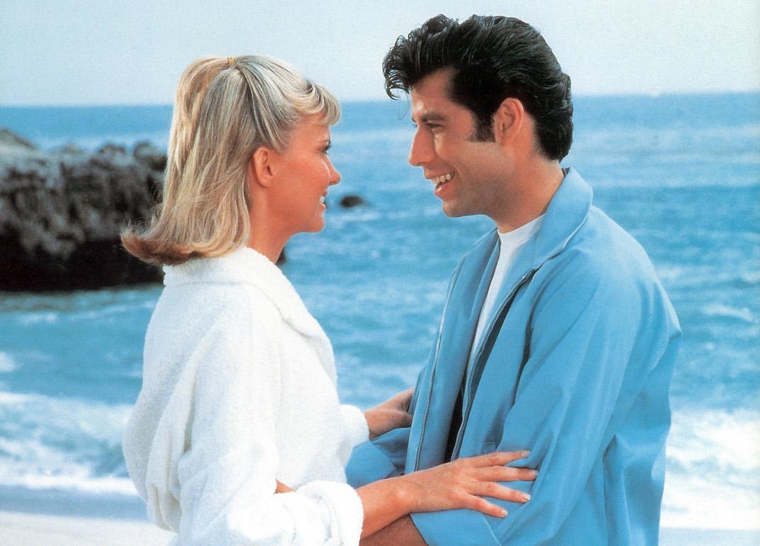 Actors Olivia Newton-John and John Travolta on the beach in a scene from the 1978 film 'Grease.'
