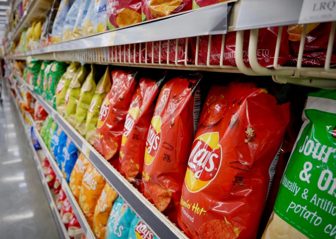 Chips on shelves at grocery store.