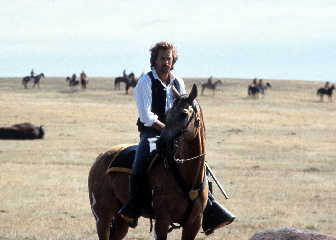 Kevin Costner riding a horse on a wide open plain in a scene from the film "Dances With Wolves", 1990.