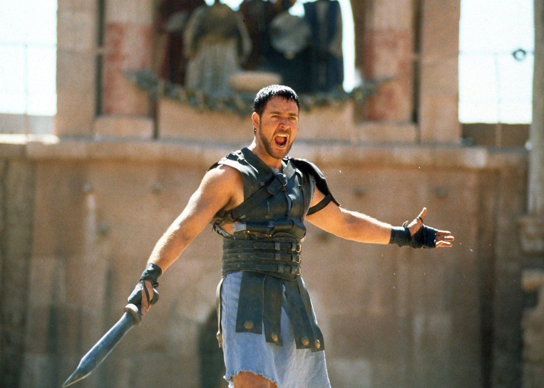 Russell Crowe holding a sword in a scene from the film 'Gladiator', 2000.