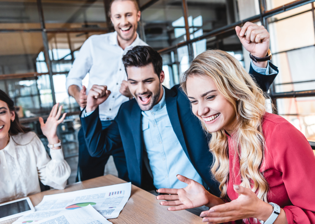 A group of office workers celebrating a success