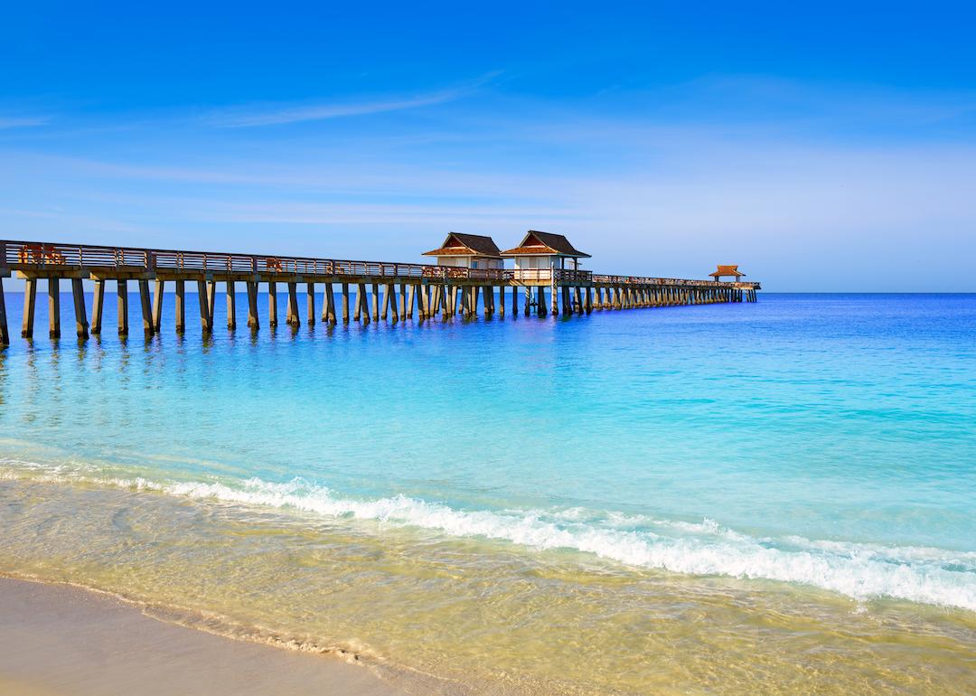 Naples pier and beach on a sunny day in Florida.