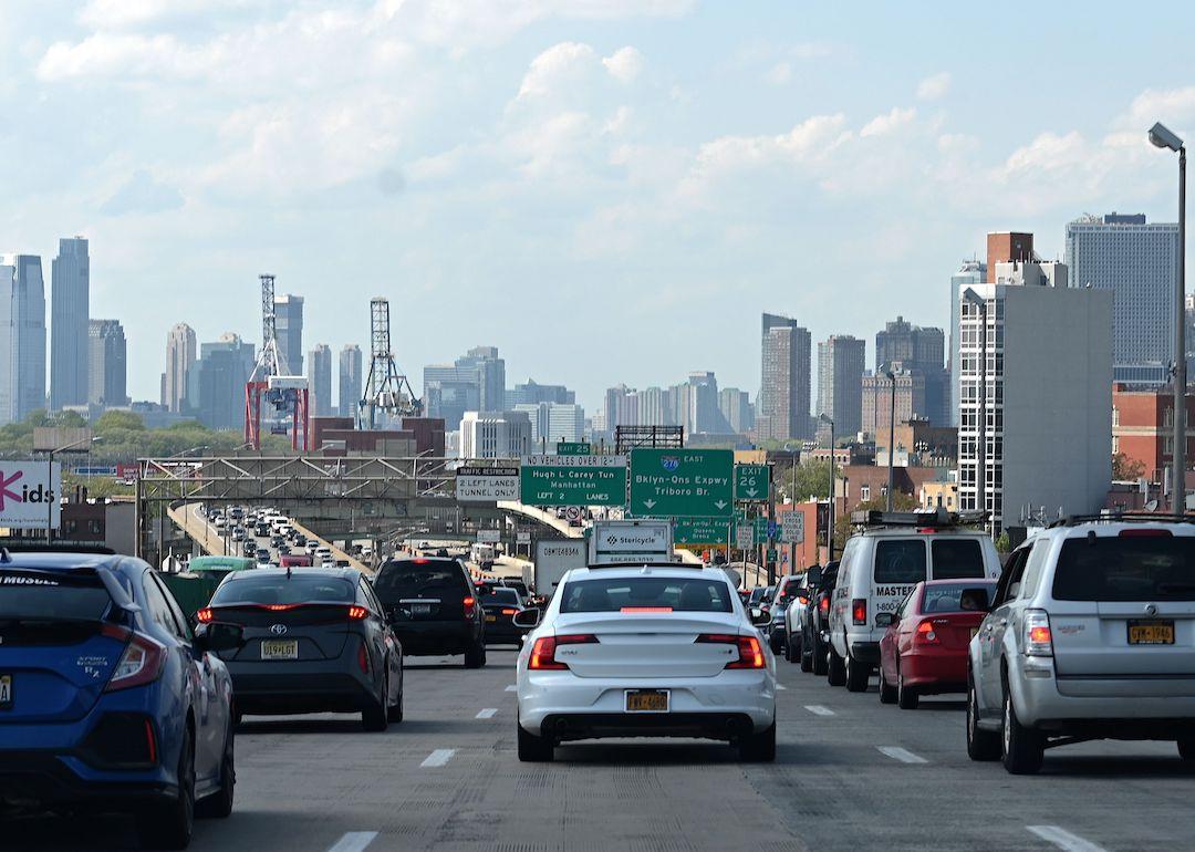 The lower Manhattan skyline is seen as a backdrop for a traffic jam on an expressway on May 15, 2020 in New York City.
