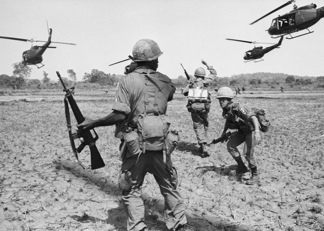 United States paratroopers spread out after disembarking from helicopters during a co-ordinated exercise in South Vietnam in 1965.