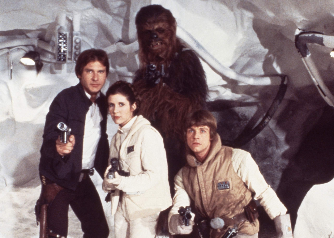 Actor Harrison Ford ,Carrie Fisher, Harrison Ford, Mark Hamill and Peter Mayhew as Chewbacca pose for a portrait on the set of Star Wars: The Empire Strikes Back in 1979 in London, England.