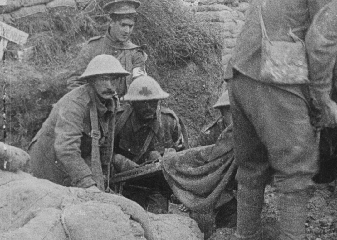 An archival photo of soldiers in trenches during World War 1 in a scene from "They Shall Not Grow Old"