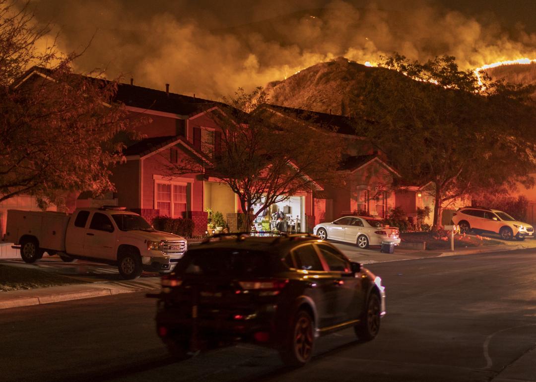 Flames come close to houses during the Blue Ridge Fire on October 27, 2020 in Chino Hills, California.