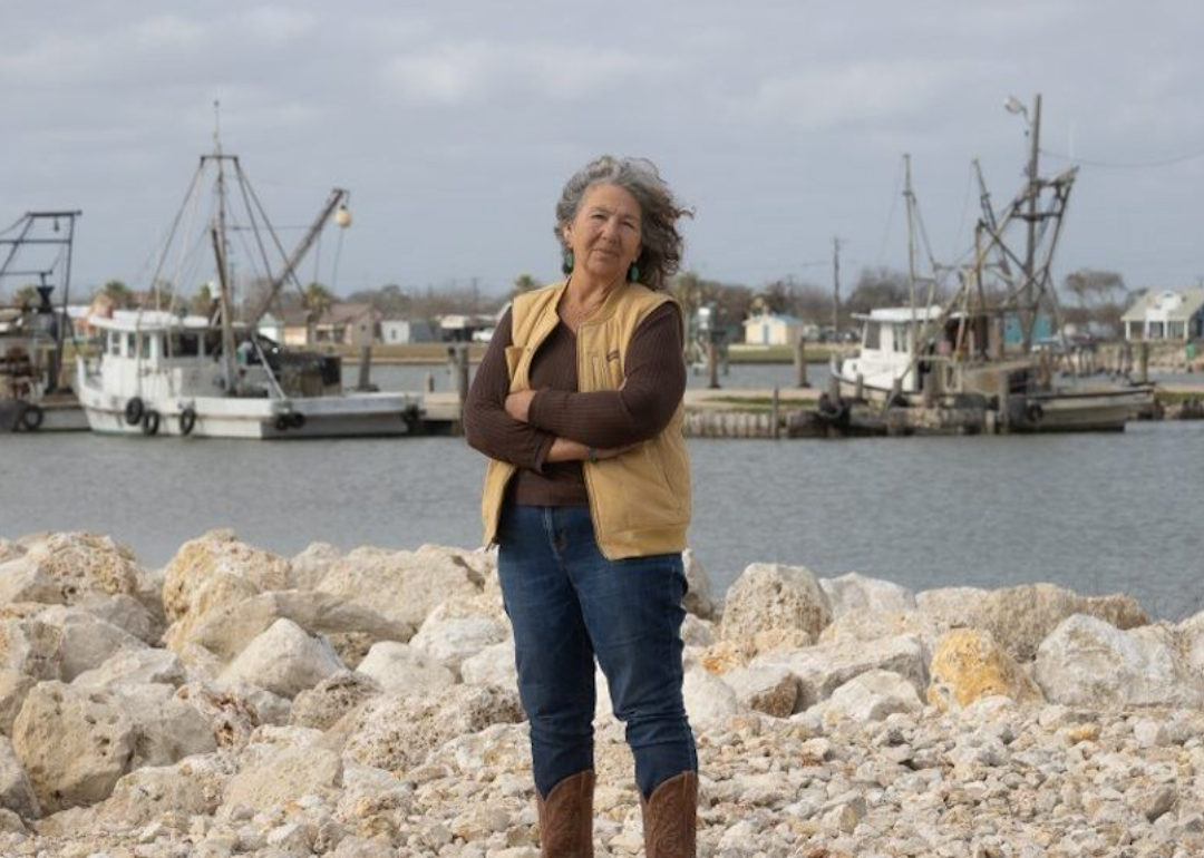 Diane Wilson stands in front of a bay in Texas