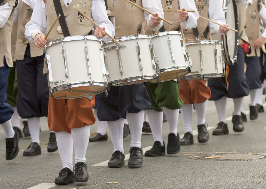 A line of costumed Civil War era drummers walking in a Thanksgiving Day Parade