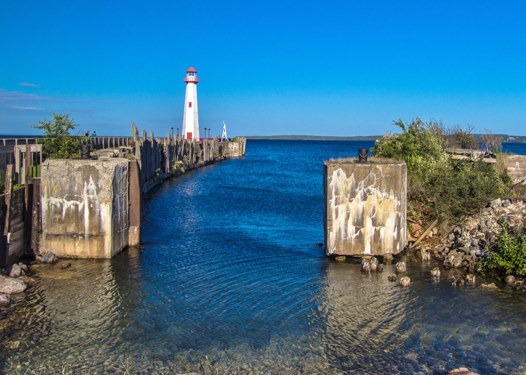 Lighthouse at the end of a pier in St Ignace, Michigan