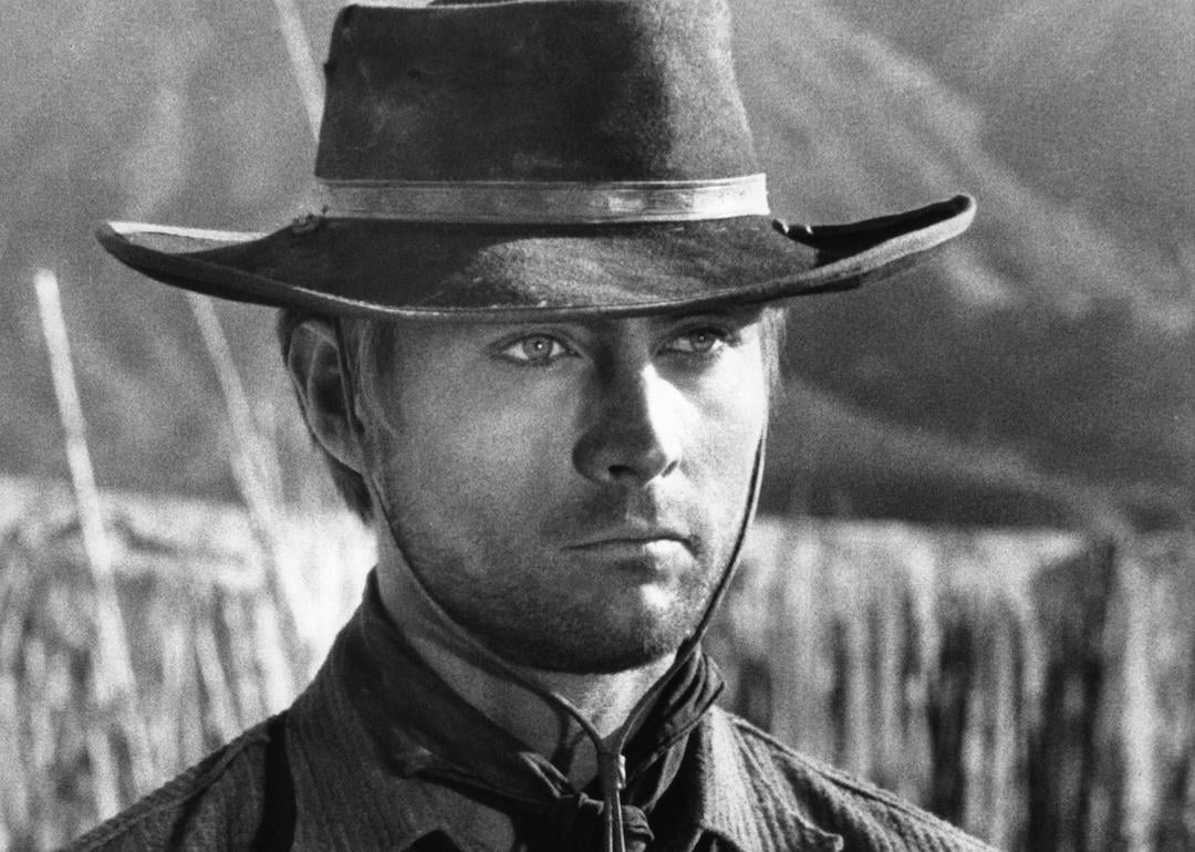 Actor John Phillip Law stands wearing cowboy hat in a scene from the 1967 film 'Death Rides a Horse.'