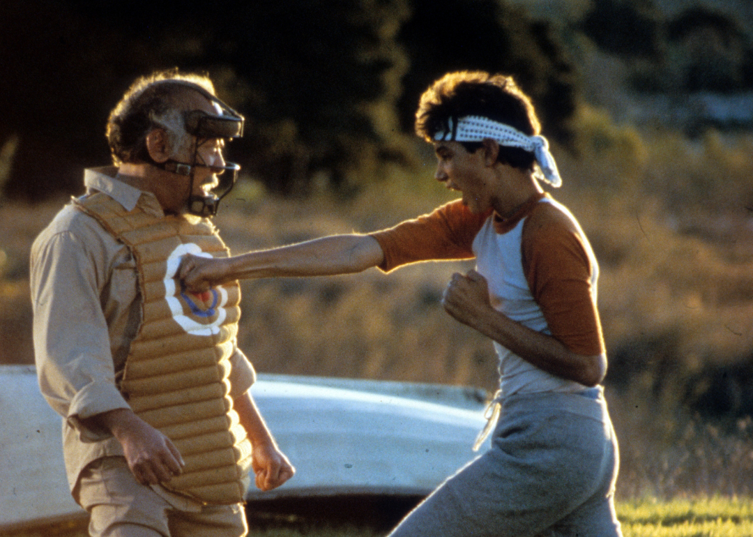 Ralph Macchio punches a dummy in a scene from the film 'The Karate Kid', 1984.