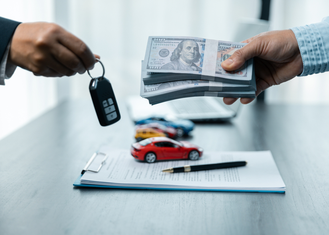 A cash handover for a car purchase