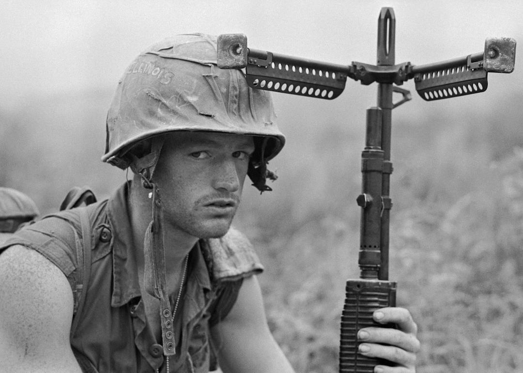 An American soldier keeps a wary eye on the hills and a firm hand on his weapon during the Vietnam War in 1968.
