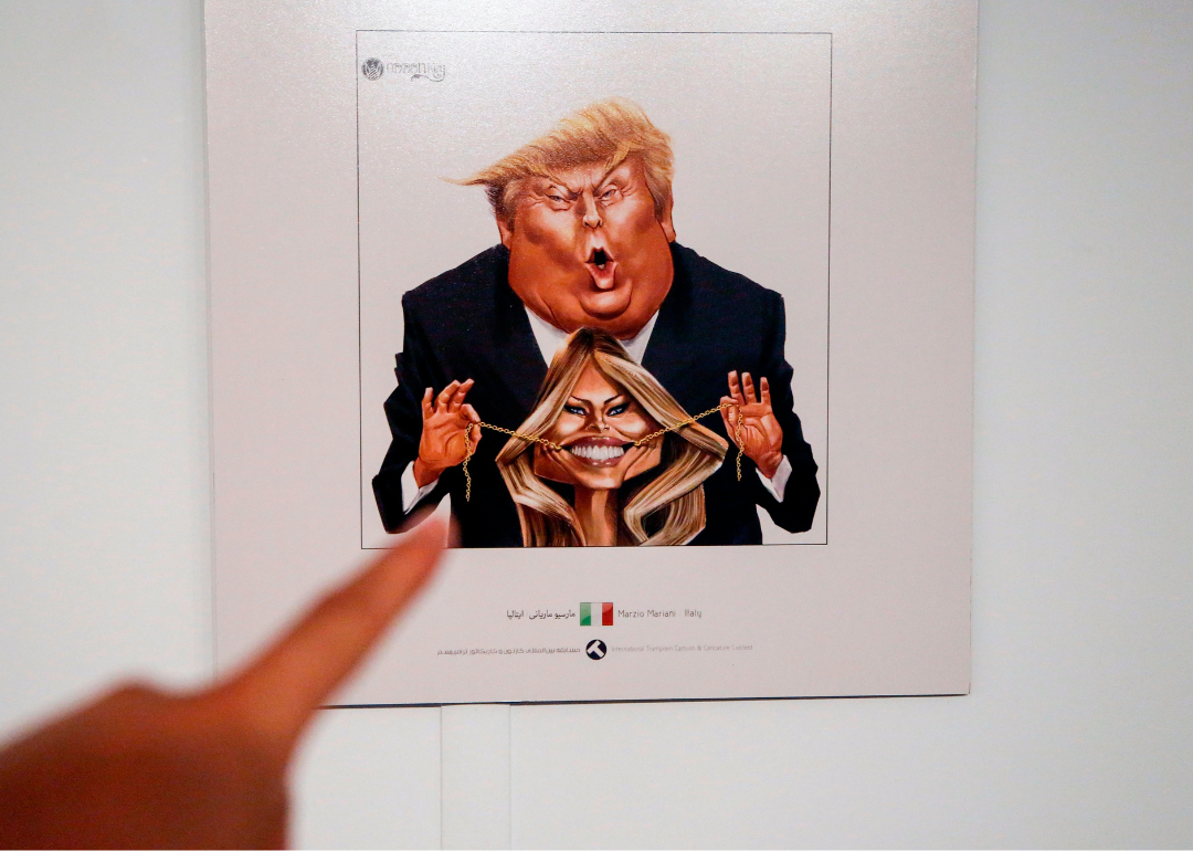 A picture taken on July 3, 2017 shows a cartoon of US President Donald J. Trump and First Lady Melania Trump on display at an exhibition of the Islamic Republic's 2017 International Trumpism cartoon and caricature contest, in the capital Tehran.