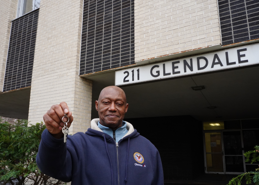 Freddie Tucker stands outside 211 Glendale, a property in Detroit that converted 60 transitional units into permanent housing units for veterans exiting homelessness.