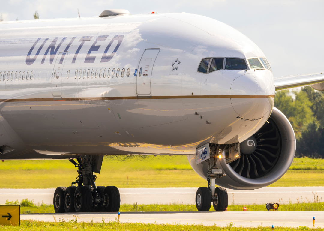 A United Airlines Boeing 777 on an airport runway in Lithuania