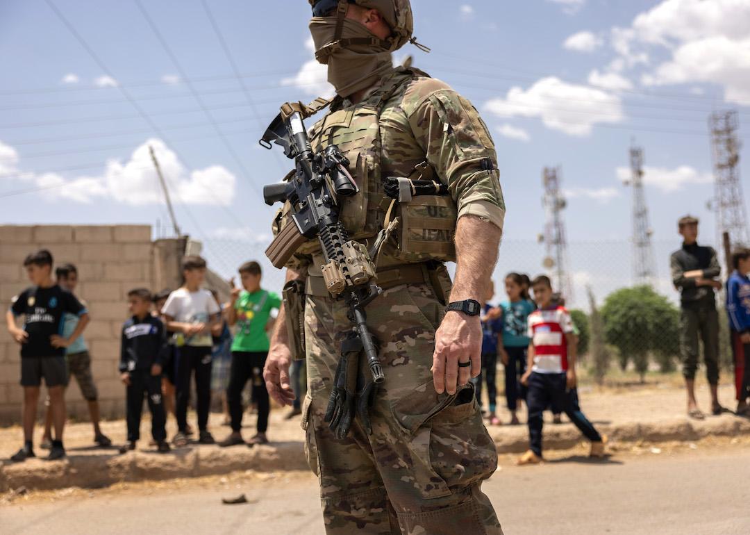 A U.S. Army soldier stands guard while on patrol on May 25, 2021 near the Turkish border in northeastern Syria.