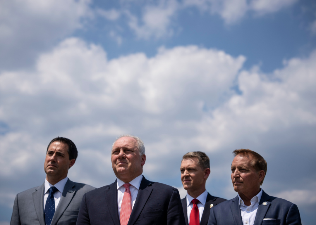 Secretaries of state such as Frank LaRose of Ohio (left), Wes Allen of Alabama (center right), and Paul Pate of Iowa (right) led their states to depart from the ERIC program for cross-state voter roll cleaning. Also pictured is U.S. House Majority Leader Steve Scalise of Louisiana (center left) at a news conference in July in Washington, D.C. 