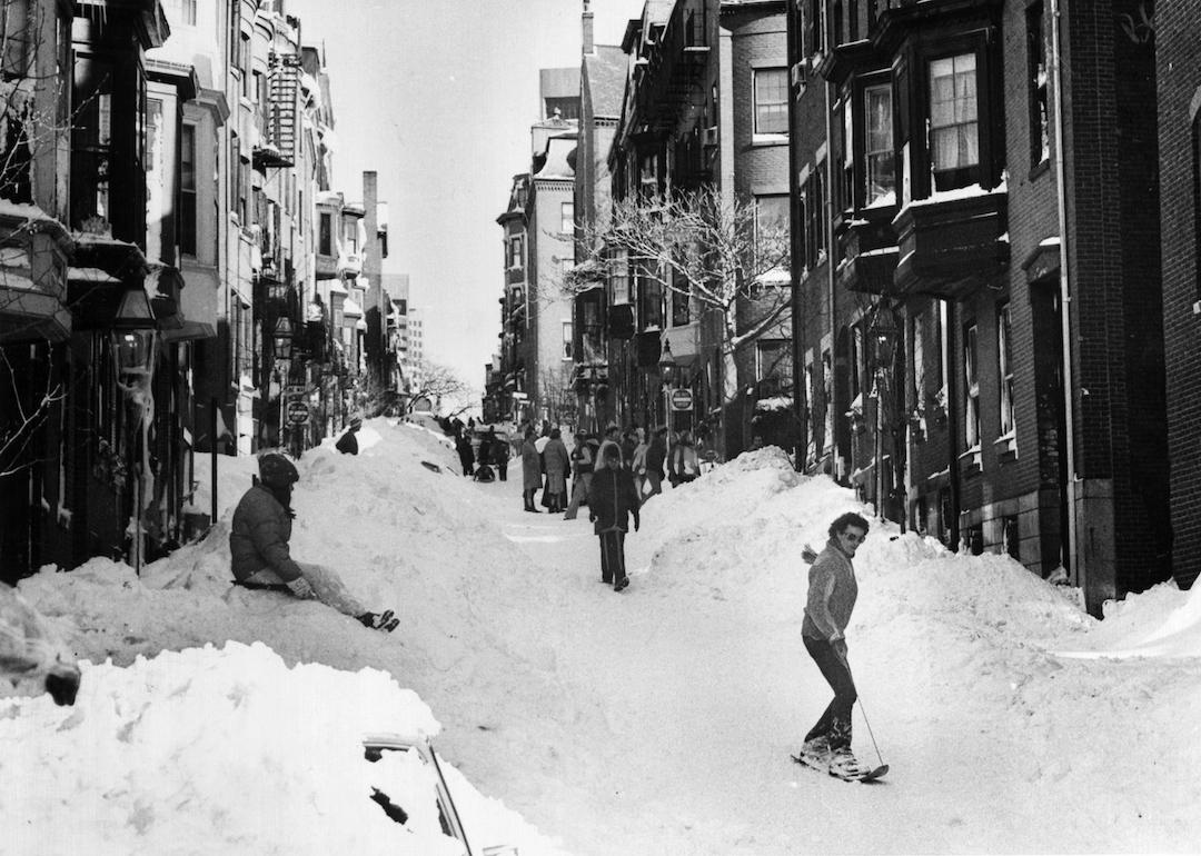  A person glides down Revere Street in the Beacon Hill neighborhood of Boston on Feb. 8, 1978 after a blizzard.