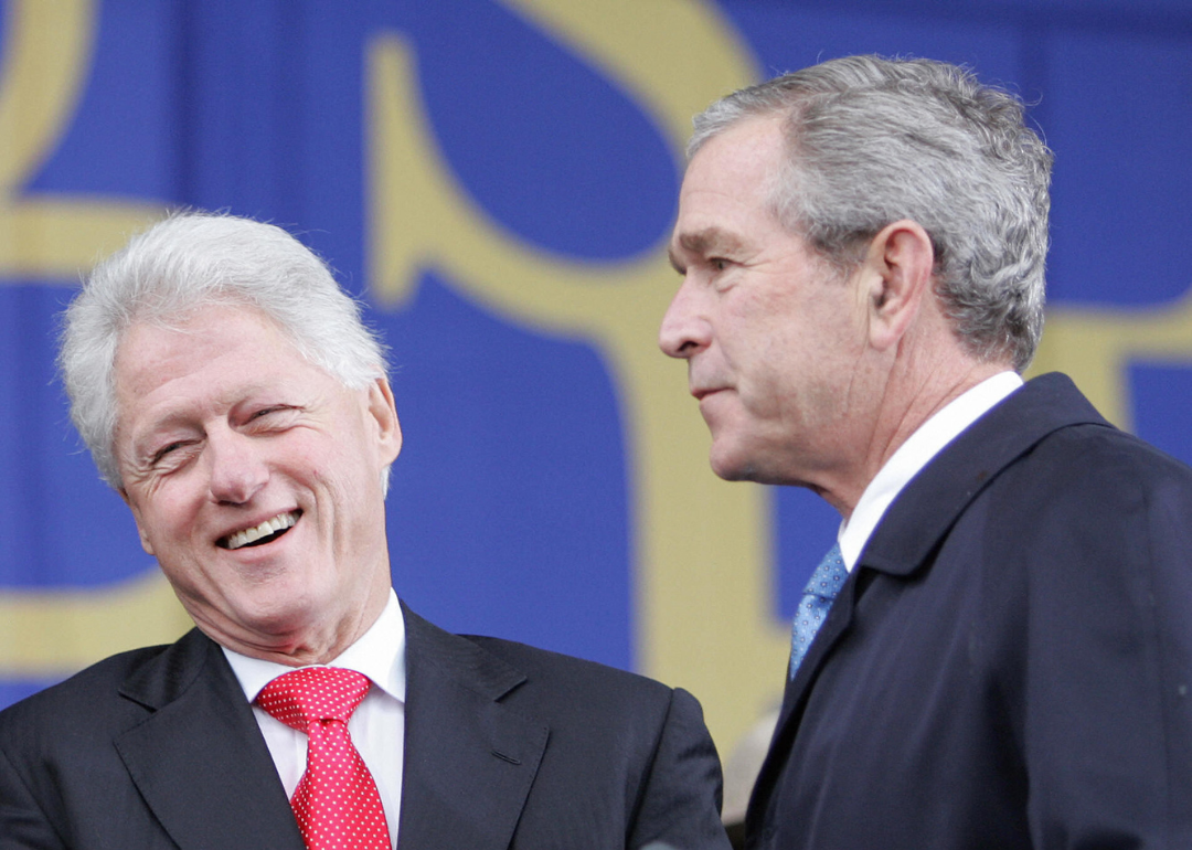 Former US President George W. Bush (R) stands with former US President Bill Clinton (L) at the ceremonial groundbreaking of the Martin Luther King Jr. National Memorial 13 November, 2006 on the National Mall in Washington, DC. 