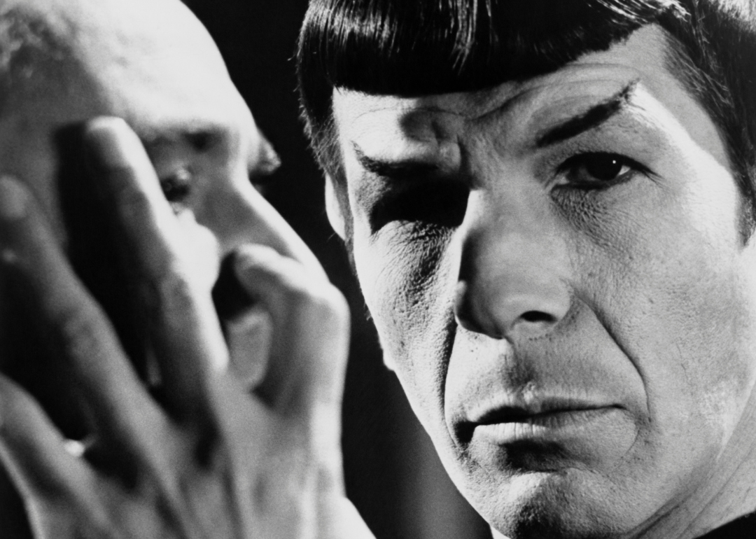 Leonard Nimoy playing a Vulcan, Commander Spock, a crew member of the Starship Enterprise in the "Star Trek" American TV series
