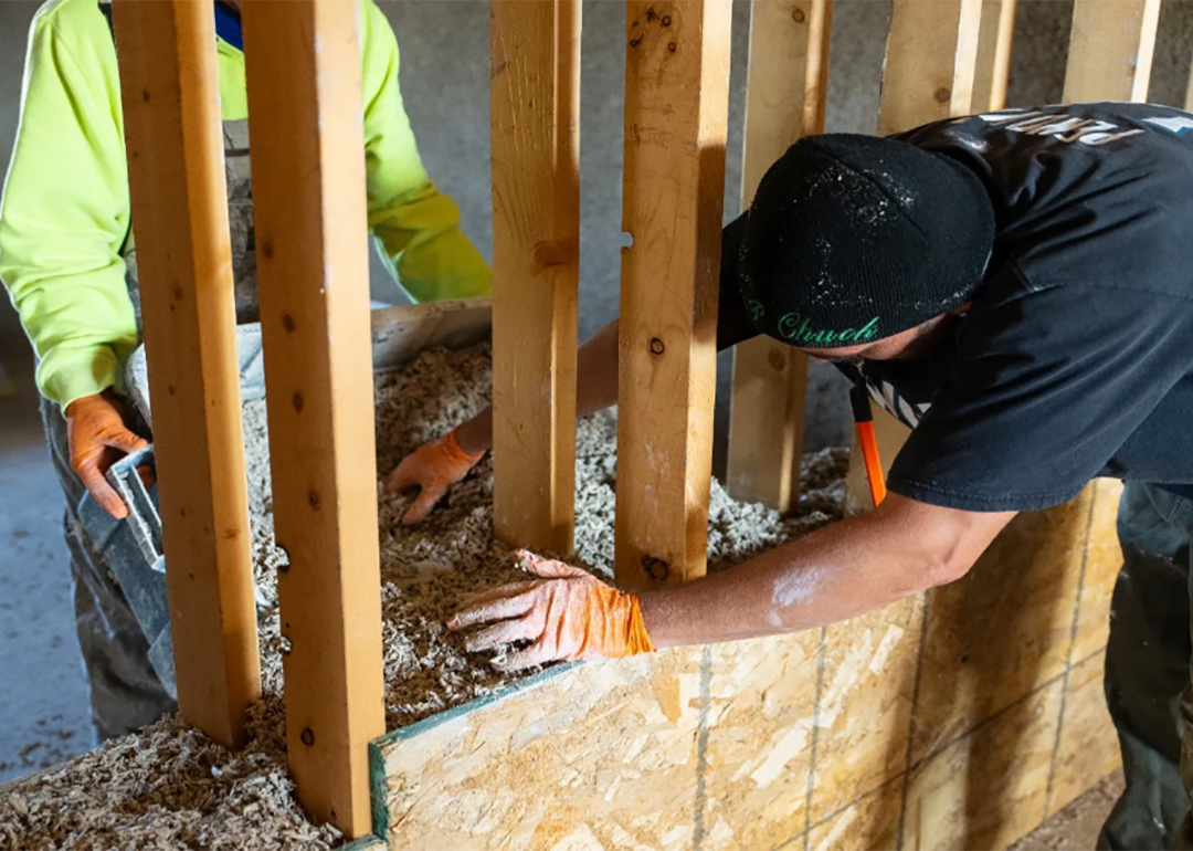 two men working on building a home with hempcrete