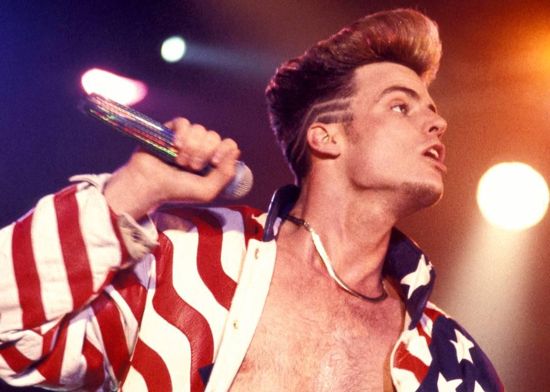 Rapper Vanilla Ice performs in an American flag jacket in 1990.