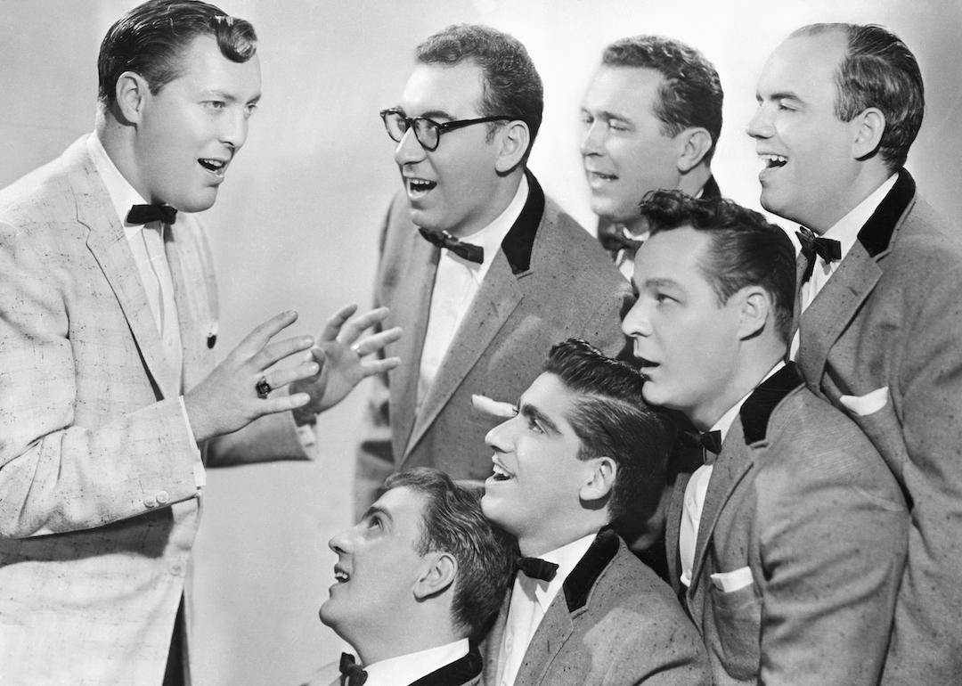 Bill Haley & His Comets sing in matching tuxedos.