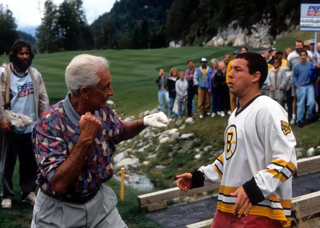 TV host Bob Barker prepares to punch comedian Adam Sandler in a scene from the 1996 film 'Happy Gilmore.'