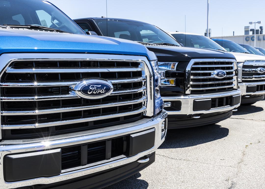 Used Ford trucks for sale in lot.