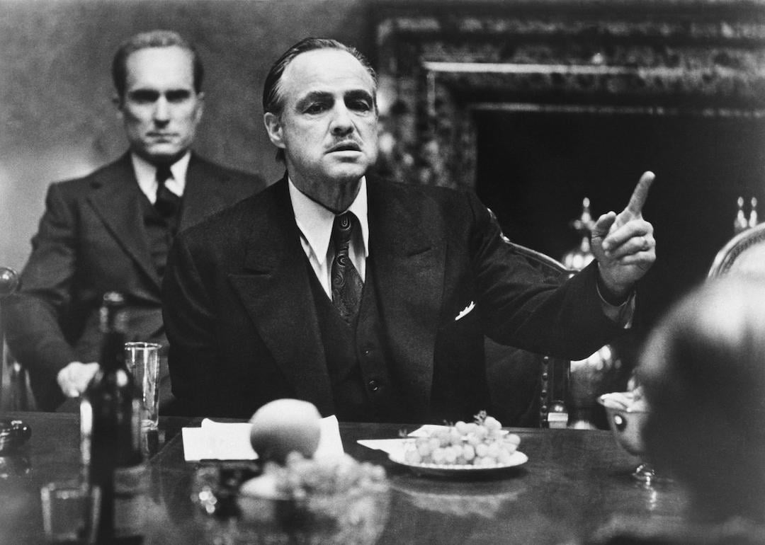 Marlon Brando as Don Vito Corleone in ‘The Godfather’; behind him is Robert Duvall as Tom Hagen, Don's lawyer.