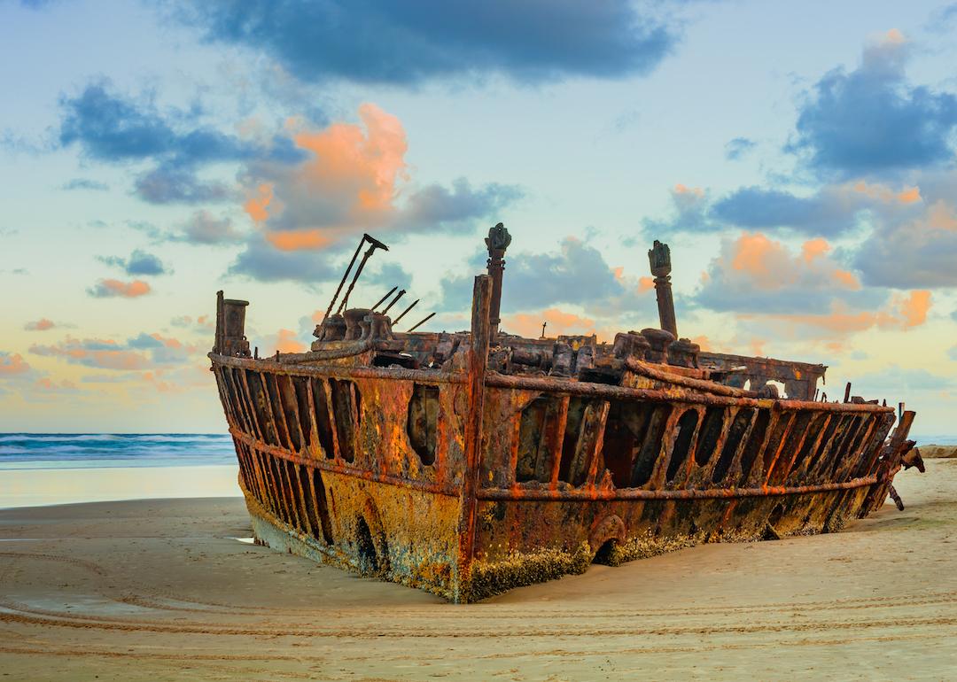 Maheno shipwreck at sunset on Fraser Island in Queensland, Australia.