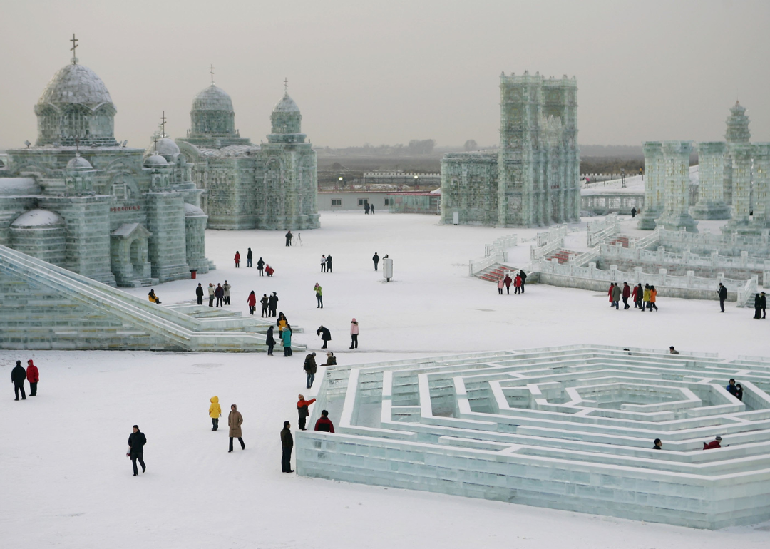 Tourists view ice buildings on display in the Grand Ice and Snow World at 23rd Harbin International Ice and Snow Festival on January 5, 2007 in Harbin, Heilongjiang Province in north China.