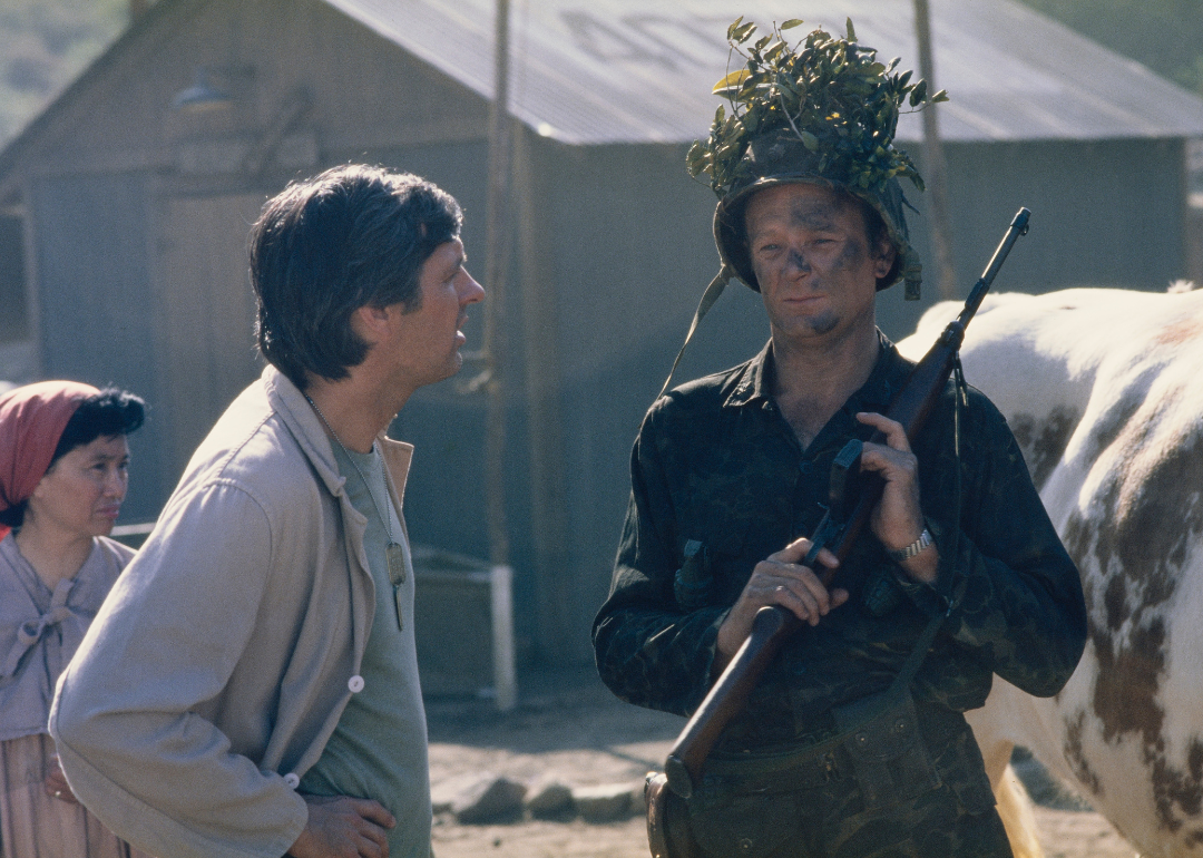 Alan Alda and Larry Linville during the filming of television show M*A*S*H, United States, August 1976. They play the characters Capt. Benjamin Franklin "Hawkeye" Pierce and Maj. (Lt. Col.) Frank Burns.