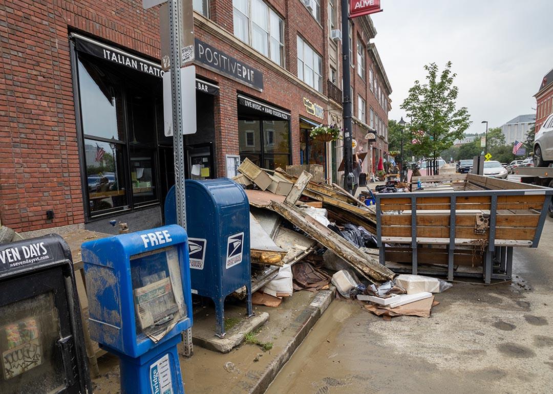 debris from flash flood piled in front of restaurant in Montepelier, Vermont