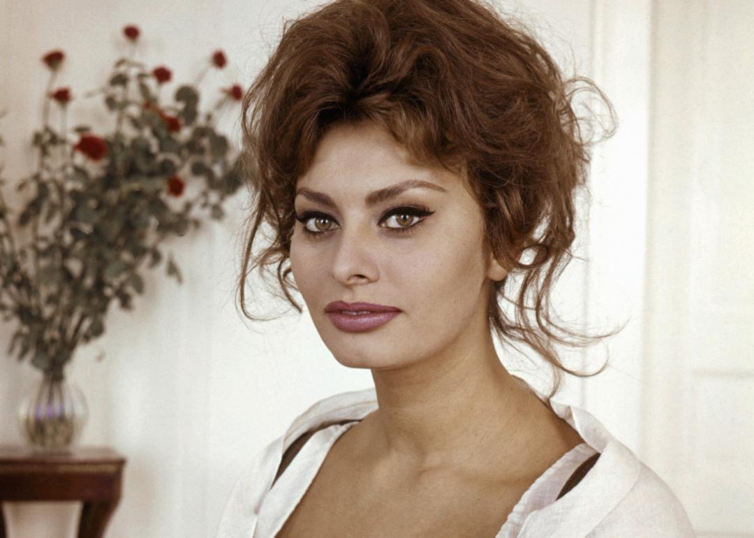 Actor Sophia Loren poses for a portrait in a white dress circa 1960. 