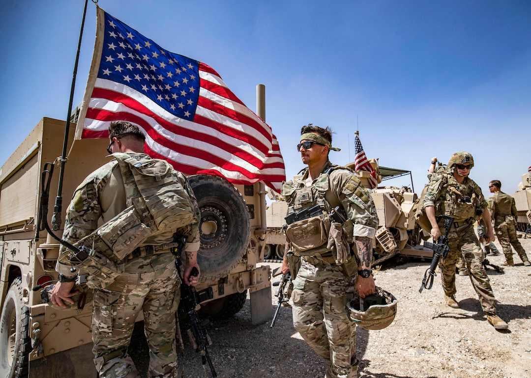 U.S. Army soldiers patrol the countryside of Rumaylan (Rmeilan) in Syria's northeastern Hasakeh province on June 7, 2023.