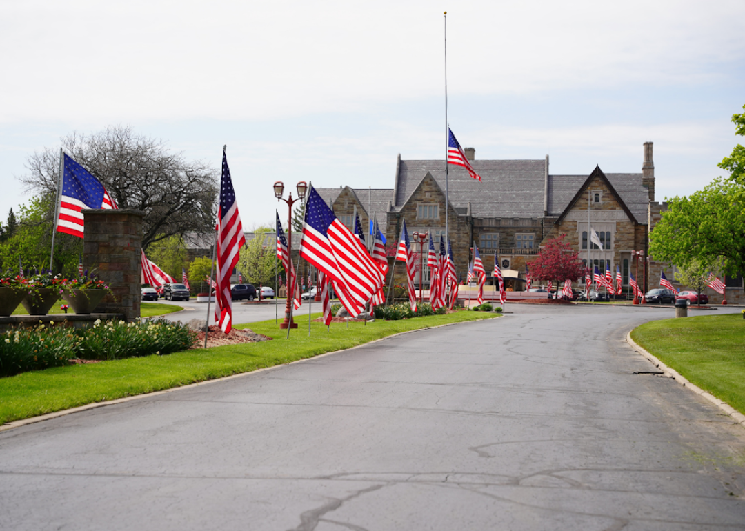 American flags waving at Wisconsin Memorial Park cemetery in Brookfield, Wisconsin to honor and celebrate fallen soldiers and veterans of United States wars for Memorial Day.