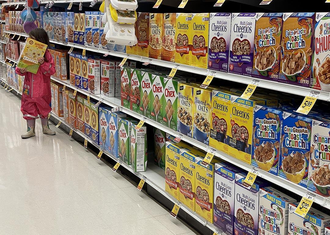 Cereal boxes displayed on a grocery store shelf.
