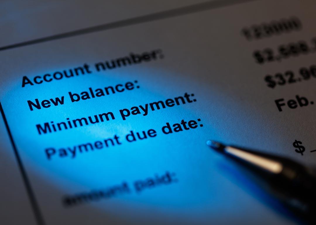 A credit card bill focused on the information showing new balance, minimum payment and due date.