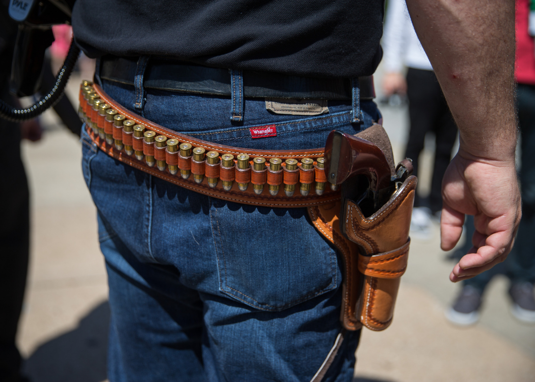 Person carrying gun and ammunition on holster at a counter-protest in response to protesters opposing the NRA's annual convention on Saturday, May 5, 2018 in Dallas, Texas.