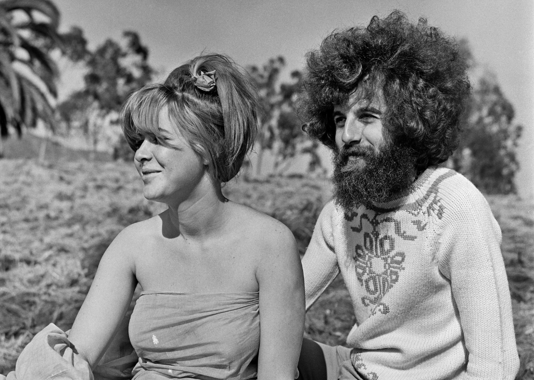 Hippies relaxing under the sun in an open field in Los Angeles, California, in summer, 1967.