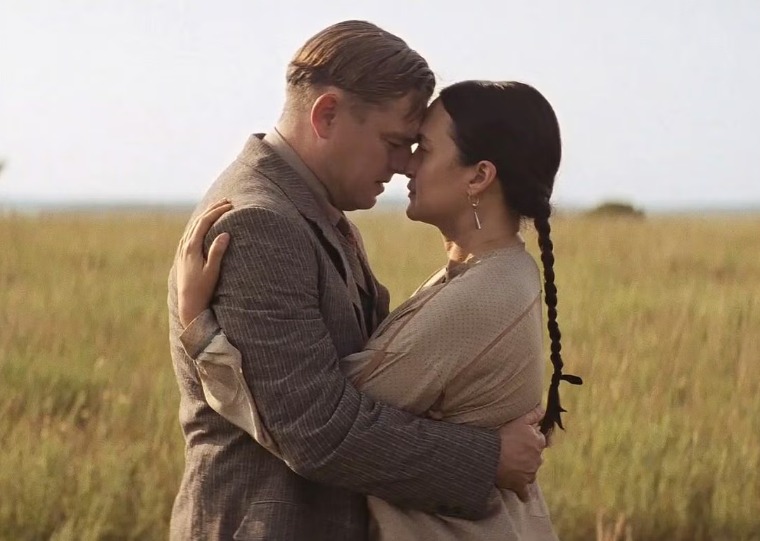 Leonardo DiCaprio and Lily Gladstone embracing in a scene from 'Killers of the Flower Moon'