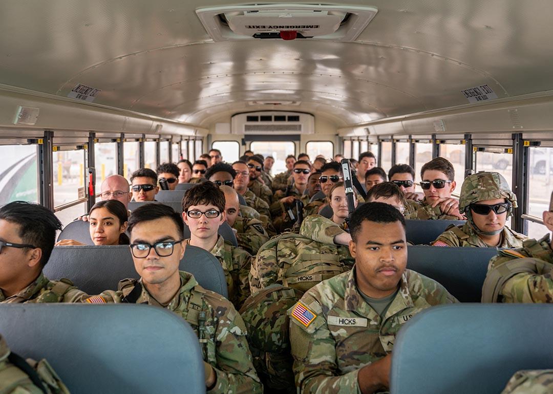 Texas Tactical Border Force guardsmen on a bus wait for departure at the Million Air El Paso ELP airport.