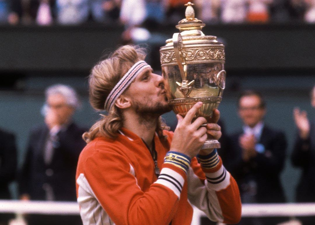 Bjorn Borg kissing the trophy after winning his fifth Wimbledon title in July, 1980. 