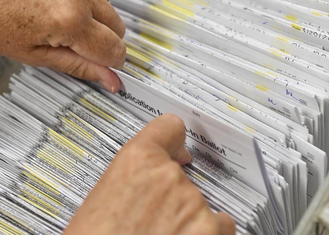 Donna Blatt, the Chief Registrar with the applications for mail-in ballots they have received at the Berks County Office of Election Services in the Berks County Services Building in Reading, PA 