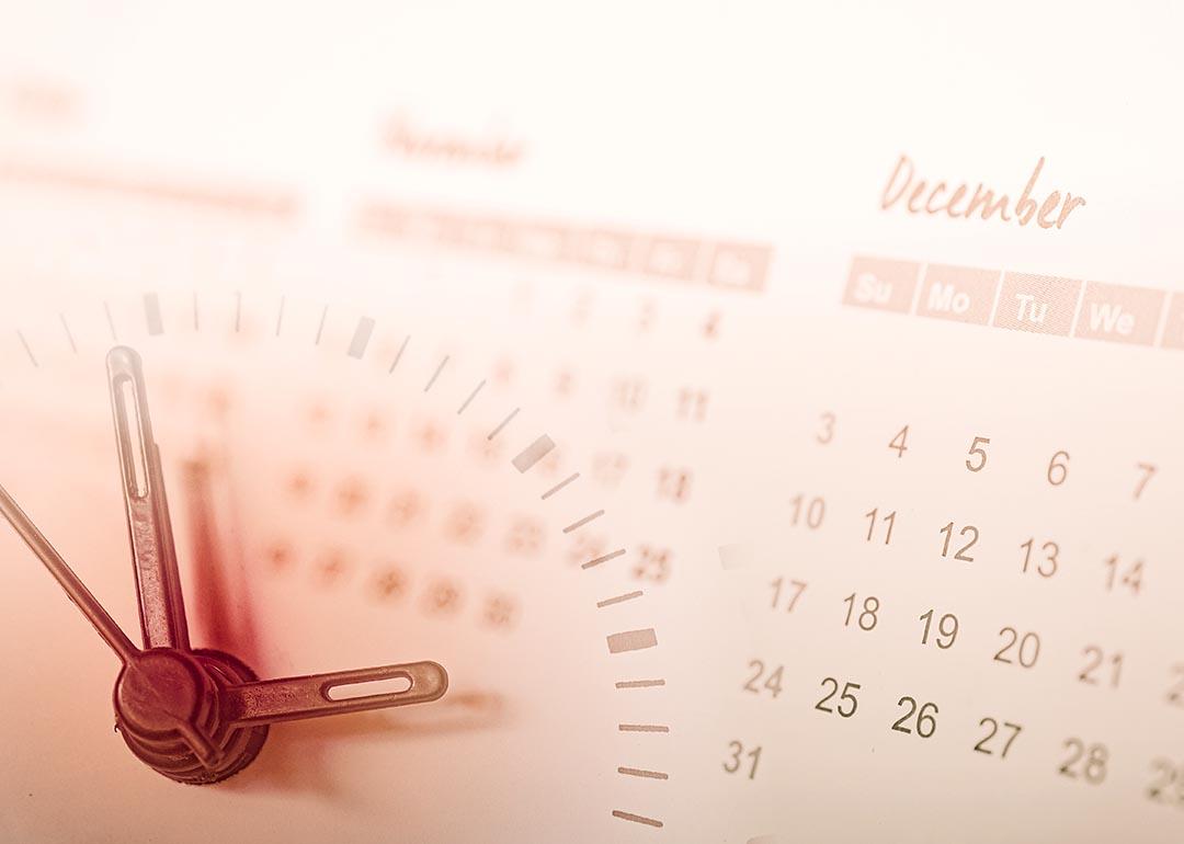 Hands of a clock are overlaid in a background of a calendar.